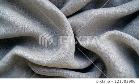 Soft woven linen fabric texture in gentle gray hue, showcasing its natural elegance 121302906