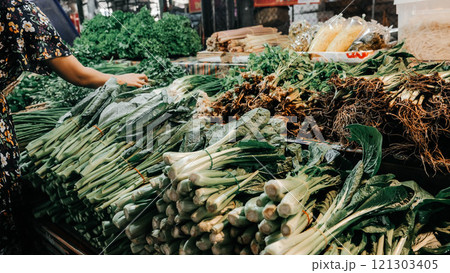 A Fresh Produce Market Featuring an Abundance of Vibrant Green Vegetables for Sale 121303405