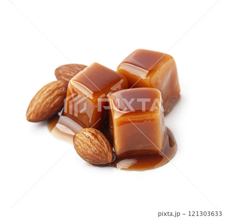 Caramel candy with caramel topping and almonds  nuts 121303633