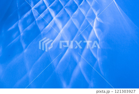Minimalism abstract background with pattern shadows on a blue paper Minimalism abstract background with pattern shadows on a blue paper 121303927