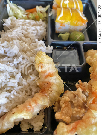 tempura shrimp with rice and mango rolls in a Japanese restaurant 121304422