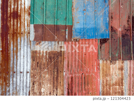 multi-colored iron sheets, corrugated sheets of old roofing material, colored background 121304423