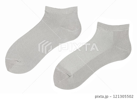 Grey long socks is isolated on a white background. Grey long socks is isolated on a white background. 121305502