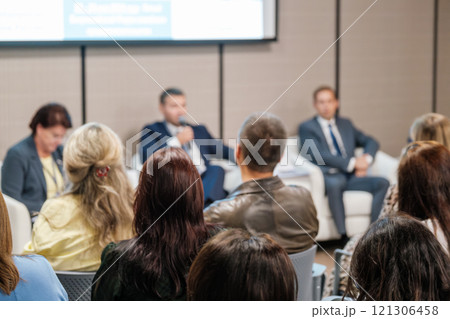 Audience attending a corporate panel discussion at a professional conference event Audience attending a corporate panel discussion at a professional conference event 121306458