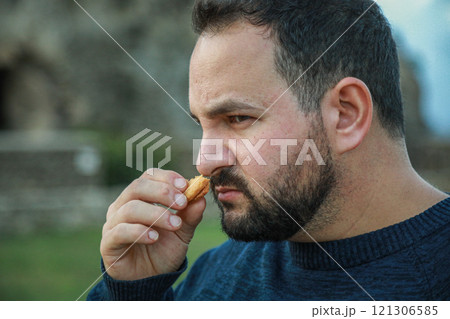 Man Shows Disgust After Biscuit Smelling 121306585