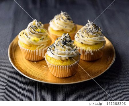 delicious Indulge in the decadent and creamy goodness of Lemon Poppy Seed Cupcakes 121308298