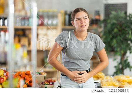 Young woman feels pain during menstruation Young woman feels pain during menstruation 121308938