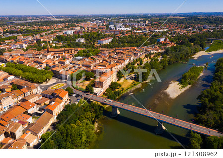Flight over the city Muret and Garonne river on summer day 121308962