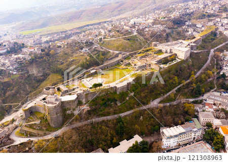 Aerial view of ruined medieval fortress on hilltop above Gjirokaster city Aerial view of ruined medieval fortress on hilltop above Gjirokaster city 121308963