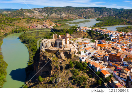 Top view of the city of Cofrentes and the medieval castle by river. Spain Top view of the city of Cofrentes and the medieval castle by river. Spain 121308968