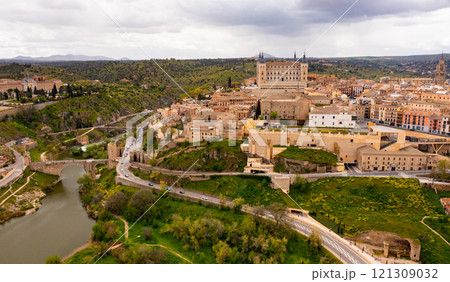 Drone view of Toledo on Tagus river with medieval Alcazar fortress Drone view of Toledo on Tagus river with medieval Alcazar fortress 121309032