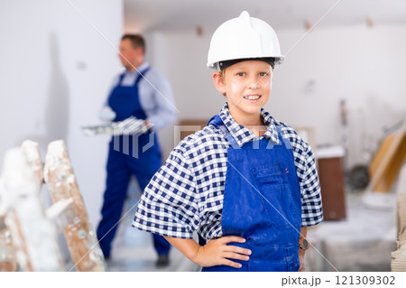 Little helper portrait - son helps father to renovate room Little helper portrait - son helps father to renovate room 121309302
