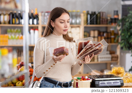 Girl choose hamon in store Girl choose hamon in store 121309323