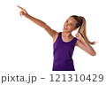 sporty fitness woman standing and pointing finger to blank space for advertise text, isolated white background. 121310429