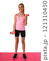 Healthy fitness teen girl in full length doing exercises with dumbbells isolated over white background 121310430
