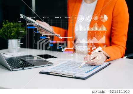 Business hand Project manager working and update tasks and Gantt chart scheduling virtual diagram. 121311109