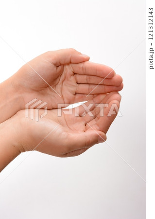 Open hands cupped together against a white background Open hands cupped together against a white background 121312143