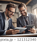 Business colleagues reviewing a tablet in office setting 121312340