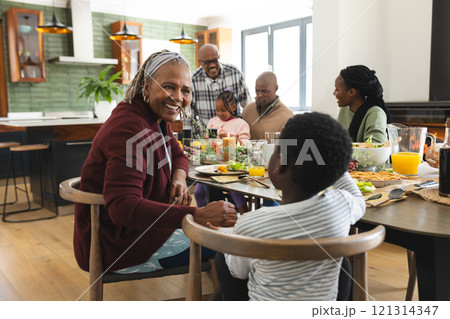 African american parents, children and grandparents celebrating at thanksgiving dinner African american parents, children and grandparents celebrating at thanksgiving dinner 121314347
