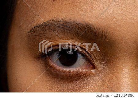 Close up of eye of asian woman with dark hair 121314880