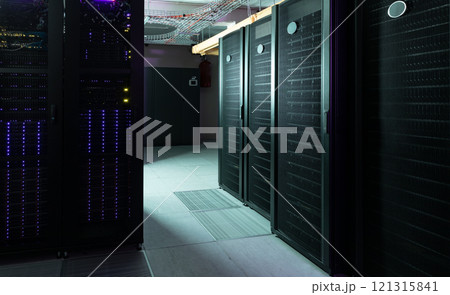 Data center with multiple rows of fully operational server racks Data center with multiple rows of fully operational server racks 121315841