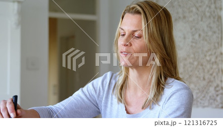 Beautiful mother serving food at home 4k 121316725