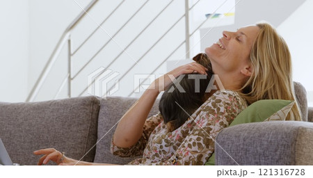 Woman playing with cat at home 4k 121316728
