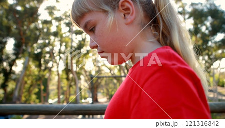 Girl walking on obstacle in boot camp Girl walking on obstacle in boot camp 121316842