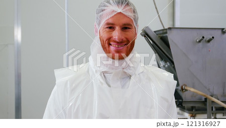 Portrait of butcher holding red meat at butcher shop Portrait of butcher holding red meat at butcher shop 121316927
