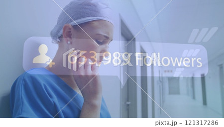 Image of followers growing number over caucasian female doctor using tablet 121317286