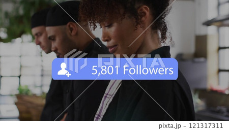 Image of followers growing number over african american female chef in reastaurant Image of followers growing number over african american female chef in reastaurant 121317311