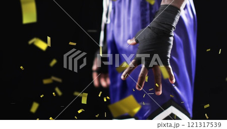 Image of confetti falling over african american male boxer on black background Image of confetti falling over african american male boxer on black background 121317539