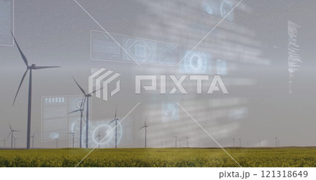 Wind turbines in field with futuristic data processing image over landscape Wind turbines in field with futuristic data processing image over landscape 121318649
