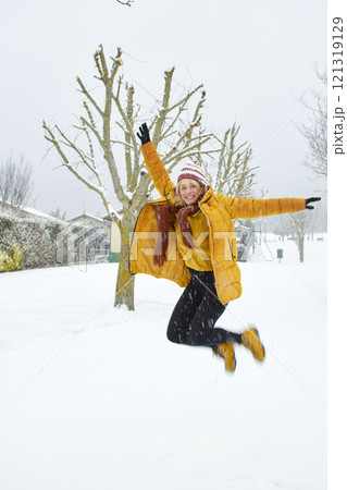 Young woman enjoying snow outdoor. 121319129