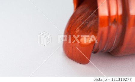 Metallic Orange Flow - A vivid orange metallic liquid oozes out of a container, capturing a rich and glossy texture on a neutral background. Metallic Orange Flow - A vivid orange metallic liquid oozes out of a container, capturing a rich and glossy texture on a neutral background. 121319277