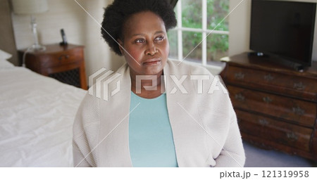 Thoughtful african american senior woman sitting on the bed at home Thoughtful african american senior woman sitting on the bed at home 121319958