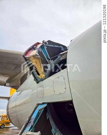 Close-up of an aircraft cargo door being opened. High quality photo Close-up of an aircraft cargo door being opened. High quality photo 121320198