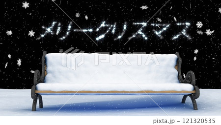 A snow-covered bench sits under a festive light display, with copy space 121320535
