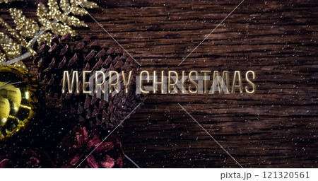 Image of merry christmas text over snow falling with christmas decorations 121320561