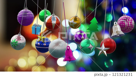 Image of christmas baubles over christmas tree background 121321231