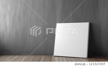 Blank square canvas leaning against a gray wall, arts architecture, indoor. 121321507