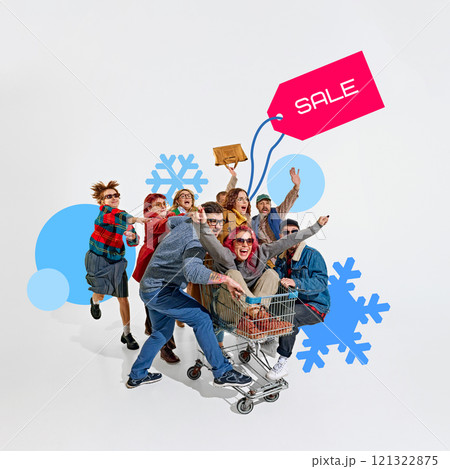 Group of shoppers energetically running and pointing towards bold SALE tag, with snowflakes and winter accents in the background. 121322875