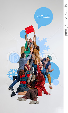 People energetically reaching for red gift box above them with SALE speech bubble, surrounded by snowflakes and winter elements. People energetically reaching for red gift box above them with SALE speech bubble, surrounded by snowflakes and winter elements. 121322919