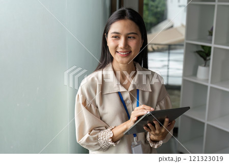 Empowered businesswomen collaborating in office urban environment professional setting inspiring innovation Empowered businesswomen collaborating in office urban environment professional setting inspiring innovation 121323019