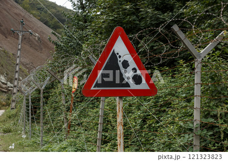 Warning sign near the border between Iran and Azerbaijan indicating landslide risk Warning sign near the border between Iran and Azerbaijan indicating landslide risk 121323823