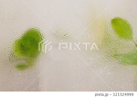 Background texture of water drop from Infused water with mint leave in cool water tank. Background texture of water drop from Infused water with mint leave in cool water tank. 121324999
