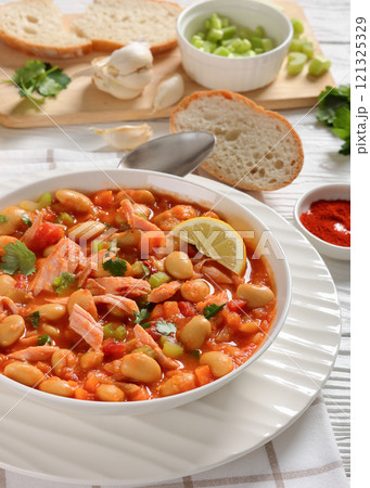 Pasulj, white bean soup with chicken in bowl 121325329