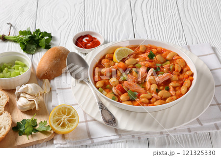 Pasulj, white bean soup with chicken in bowl 121325330