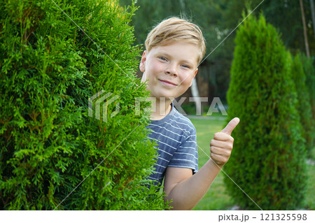 Portrait of a smiling boy on the street 121325598