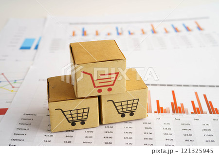Online shopping, Shopping cart box on business graph, import export, finance commerce. Online shopping, Shopping cart box on business graph, import export, finance commerce. 121325945